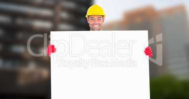 Portrait of smiling male architect holding blank card