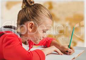 Girl doing homework against blurry brown map