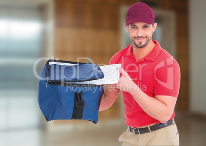 Happy pizza deliveryman with delivery bag and boxes in front of the elevator