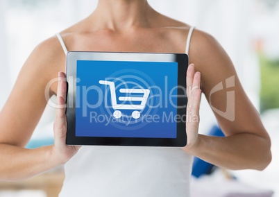 Woman holding Tablet with Shopping trolley icon