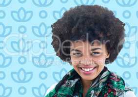 Woman with afro against blue floral pattern