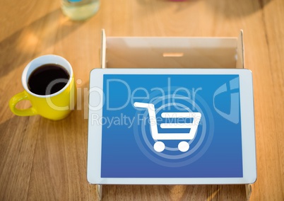 Tablet with Shopping trolley icon and coffee
