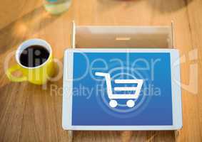 Tablet with Shopping trolley icon and coffee