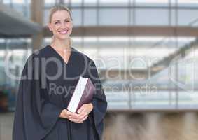 Judge holding book in front of windows