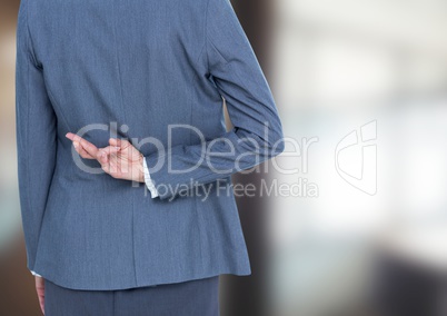 Blurred background. Office, woman with her fingers crossed