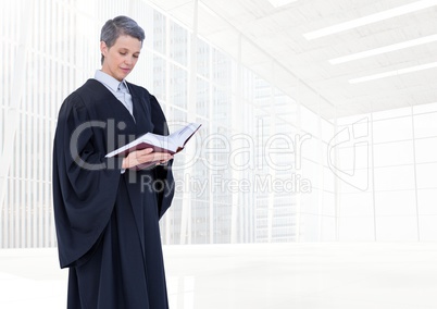 Judge holding book in front of bright windows