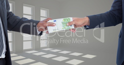 Cropped image of businessmen holding money bundle representing corruption concept