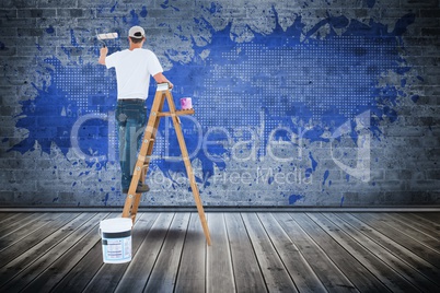 Digital composite image of man painting wall