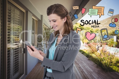 Digital composite image of businesswoman using smart phone by various icons while standing against b