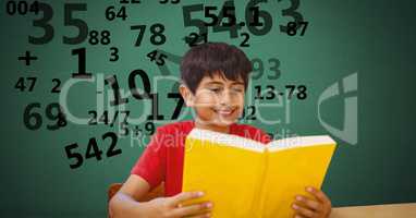 Boy studying while numbers flying in background