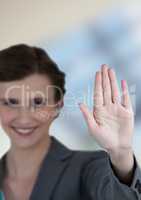 Smiling businesswoman showing stop gesture