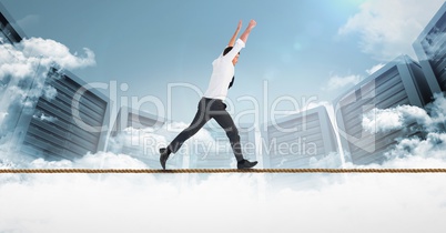 Digital composite image of businessman running on rope against servers