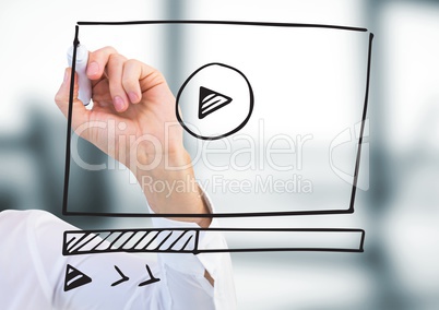 Arm with marker against website mock up in blurry office