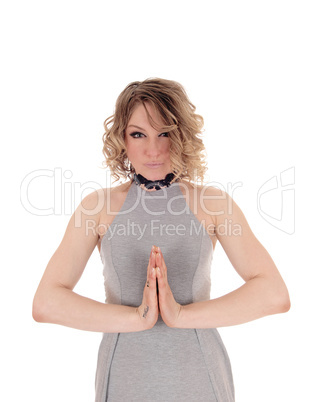 Blond woman praying.