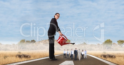 Digital composite image of female manager watering employees on street