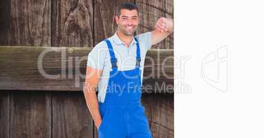 Confident worker leaning on blank bill board