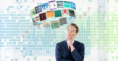 Thoughtful businessman with panels flying over head