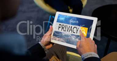 Hand searching privacy word on tablet PC