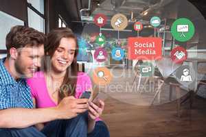Happy man and woman using mobile phone by social media graphics