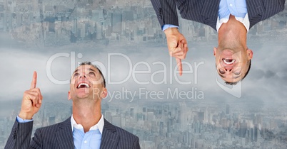 Digital composite image of upside down businessman pointing in city