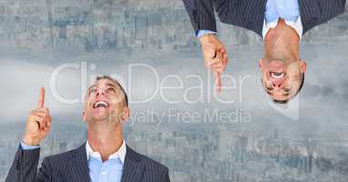Digital composite image of upside down businessman pointing in city