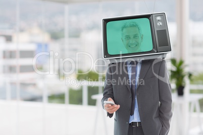 Composite image of businessman and television