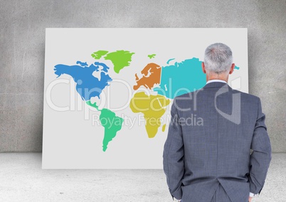 Businessman looking at Colorful Map with wall background