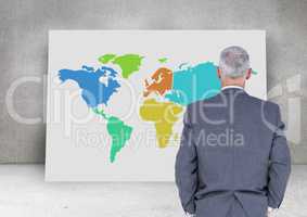 Businessman looking at Colorful Map with wall background