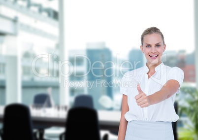 Business woman with thumb up in the meeting room