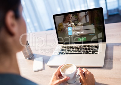 woman with coffe and laptop with login screen