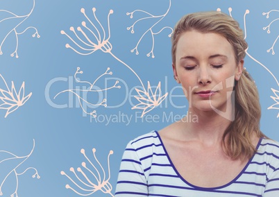 Woman with eyes closed against blue background with white floral pattern