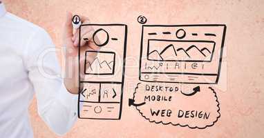Cropped image of businesswoman drawing mock ups of website