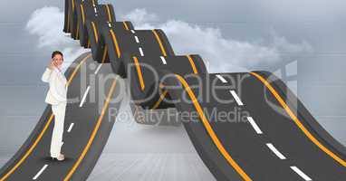 Digital composite image of businesswoman on wavy road