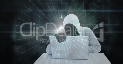 Digital composite image of hacker using laptop
