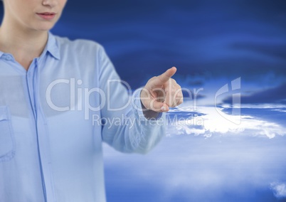 woman pointing with sky background