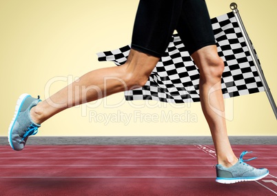 Runner legs on track against yellow background and checkered flag