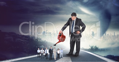 Digital composite image of businessman watering employees on highway with cityscape in background