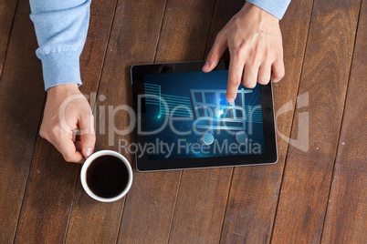 top view of man working tablet with shopping cart on screen