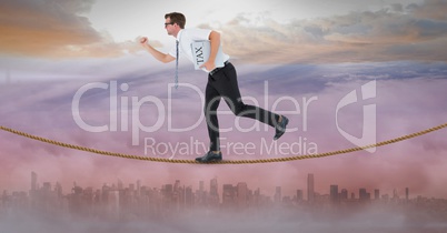 Side view of businessman holding tax newspaper while walking on rope
