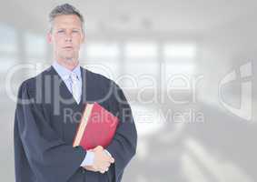 Judge holding book in front of white office