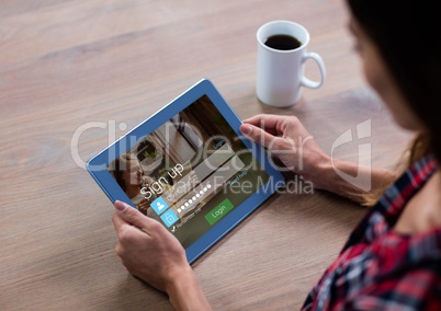 Woman with coffee and tablet in login screen