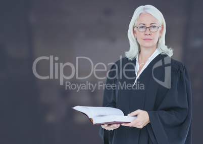 Judge holding book in front of mid tone background