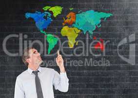 Man pointing at Colorful Map with wall background