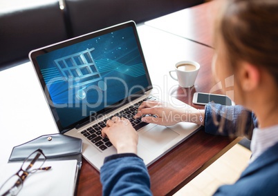 Woman using Laptop with Shopping trolley icon