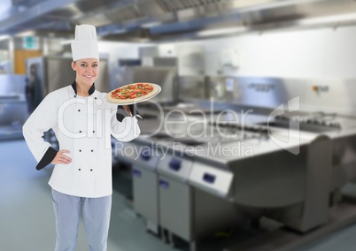 Chef with pizza in the restaurants kitchen
