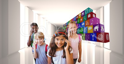 Digital composite image of school children using smart phones by icons