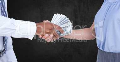 Cropped image of business people holding money representing corruption concept