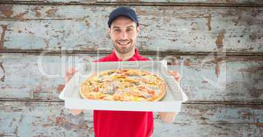 Delivery man showing pizza