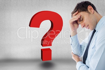 Digital composite image of tensed businessman by question mark against gray background