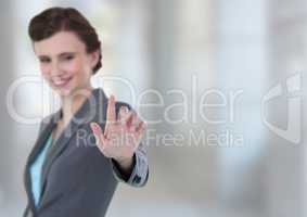 Woman touching air with bright background